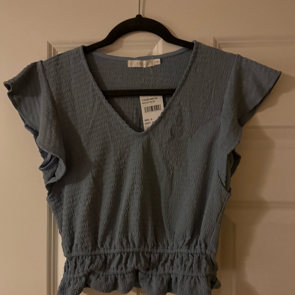 Lush Blue Flutter Sleeve Blouse with Ruffled Smocked Design